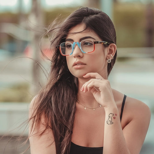 Model wearing  VL19352 Crystal Blue Tortoise semi-rimless square eyeglasses, showing the fit and colorful statement acetate frame
