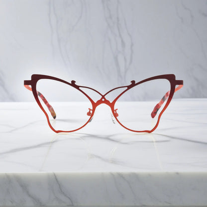 Front of VoyueLens VL185862 titanium butterfly eyeglasses in Amber Orange – a lightweight, colorful, vintage-inspired, prescription ready frame designed for unique artistic style and everyday comfort.