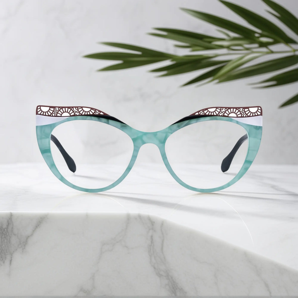 Front View of VoyueLens Aqua Frost cat-eye eyeglasses with blue-green gradient and signature lace-pattern design.