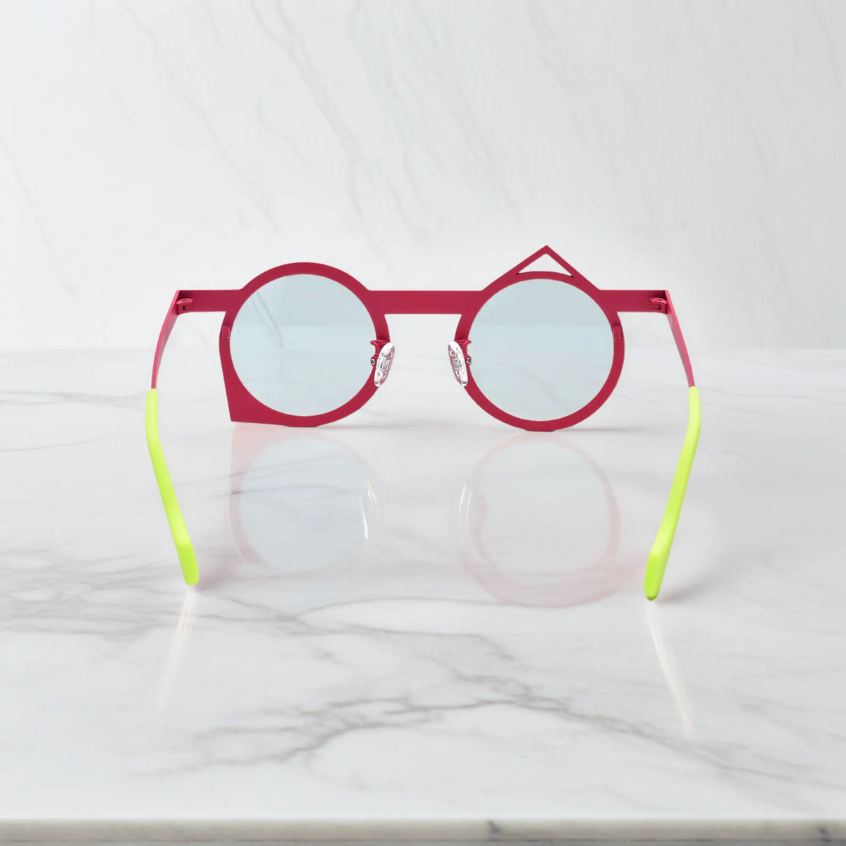 Rear display of VoyueLens VL185801 Berry Sky lightweight titanium frame in dual pastel tones.