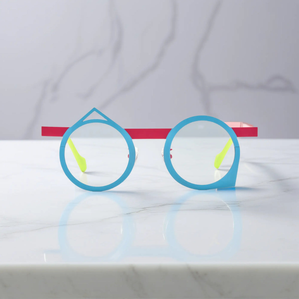 Front angle of VoyueLens VL185801 Berry Sky eyeglasses in titanium, with a striking blue-pink geometric frame.
