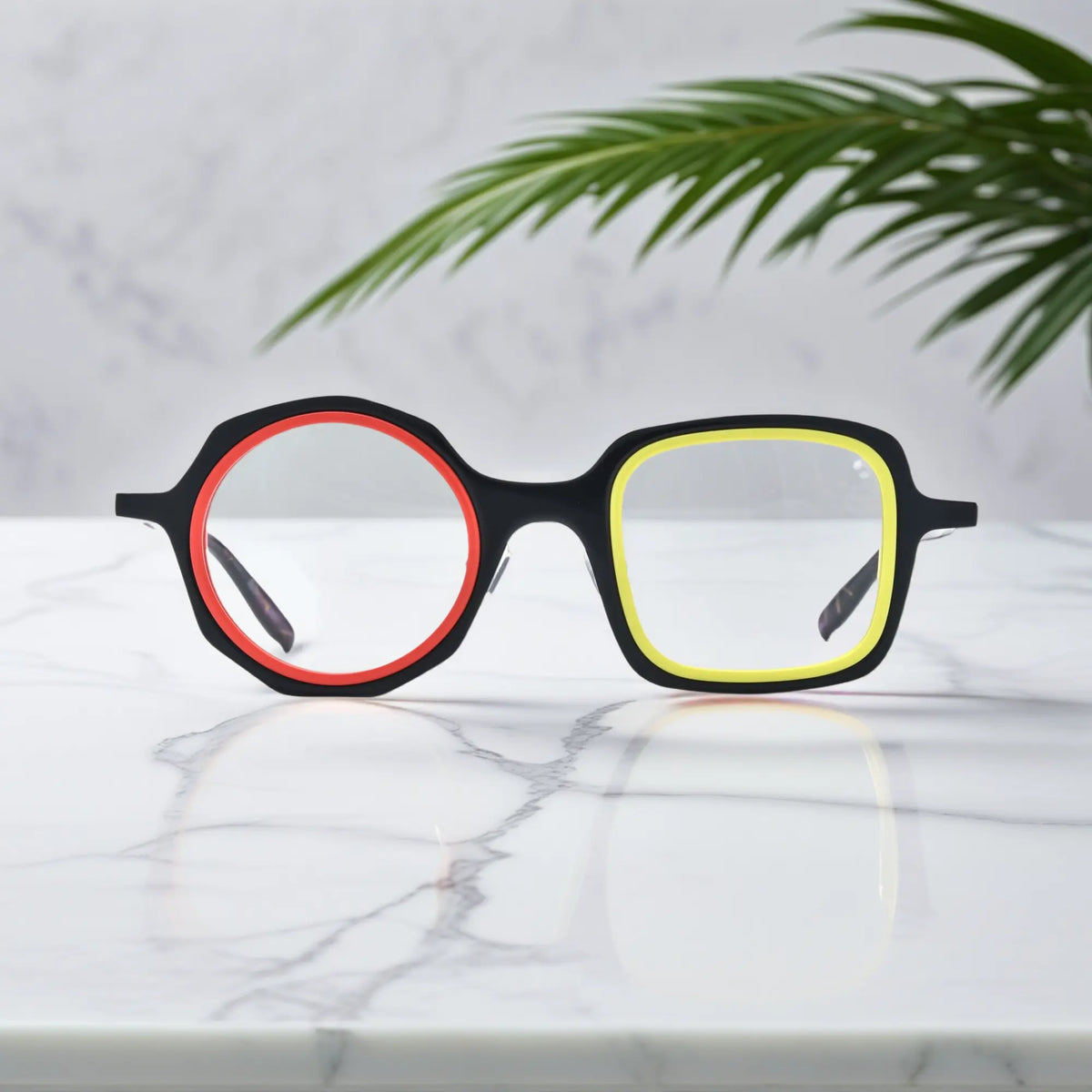 VoyueLens geometric eyeglasses in Black Amber color, shown in front view. Features acetate frame and silicone nose pads.