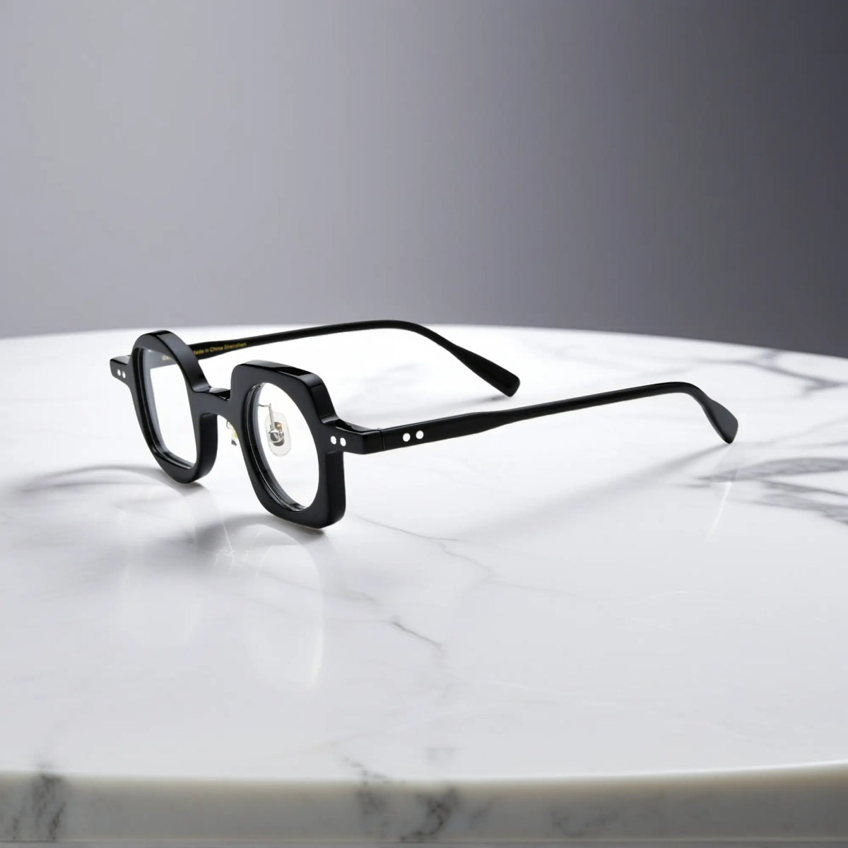 Side view showing the nano-polished black acetate frame of VoyueLens asymmetrical eyeglasses with ergonomic silicone nose pads.
