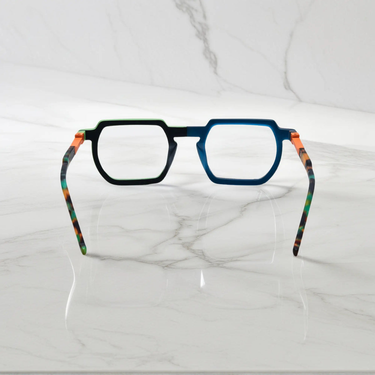 Rear view of bold Blue-Green Matte acetate frames with spring hinges and smooth finish