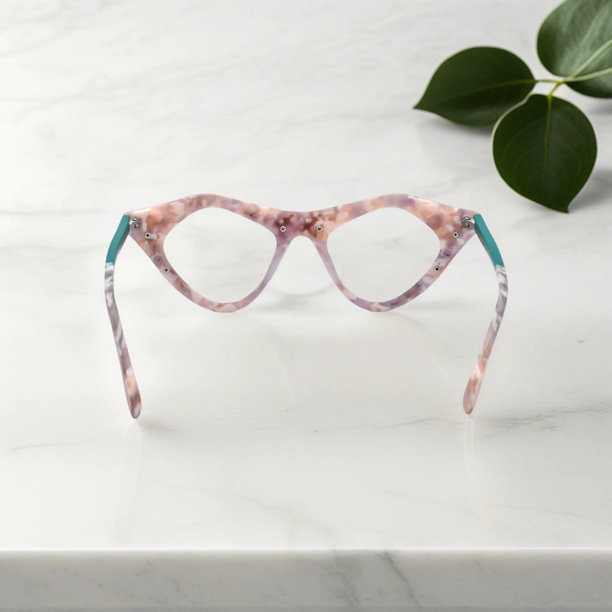 Rear view of Blush Marble VoyueLens pixel cat-eye glasses with marbled pastel texture