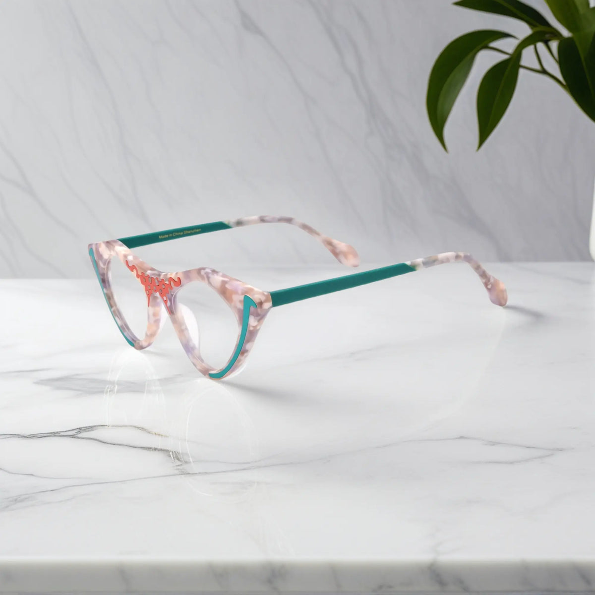 Side view of Blush Marble VoyueLens pixel cat-eye glasses in trendy pink finish