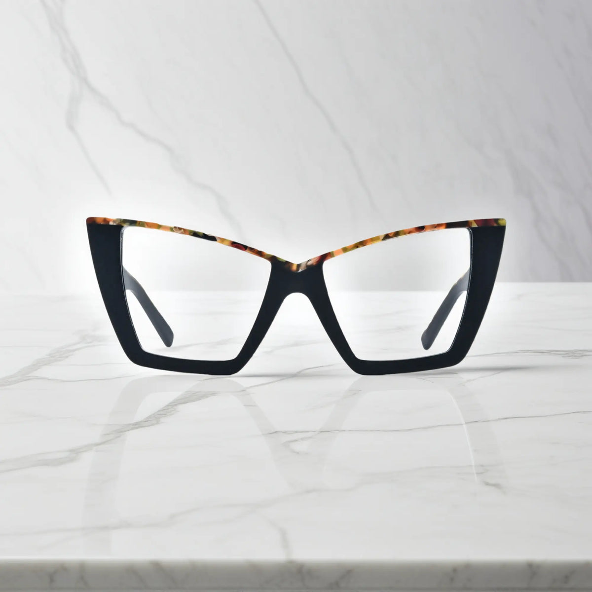 Front-facing image of VoyueLens oversized cat-eye glasses in Black-Blue Accent, featuring sharp silhouette with subtle blue inner trim for a modern contrast look