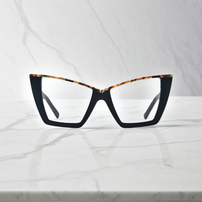 Front-facing image of VoyueLens oversized cat-eye glasses in Black-Blue Accent, featuring sharp silhouette with subtle blue inner trim for a modern contrast look