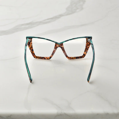 Rear view of VoyueLens oversized emerald tortoise cat-eye frame showing spring hinges and premium acetate arms