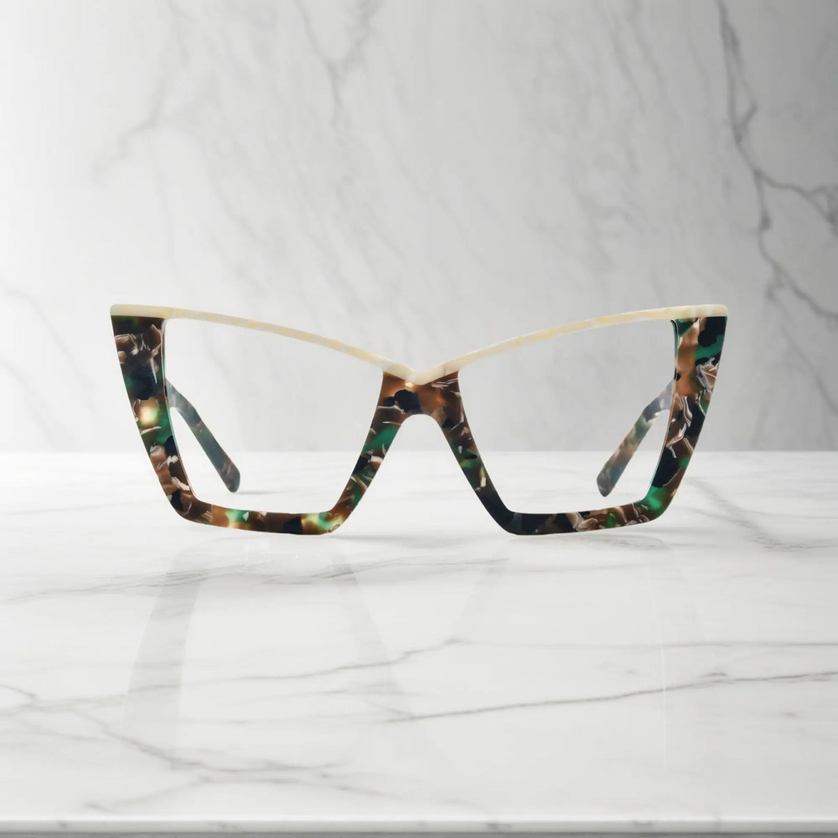 Front-facing view of VoyueLens oversized cat-eye glasses in Olive Tortoise, featuring a warm marbled acetate pattern in olive green and amber