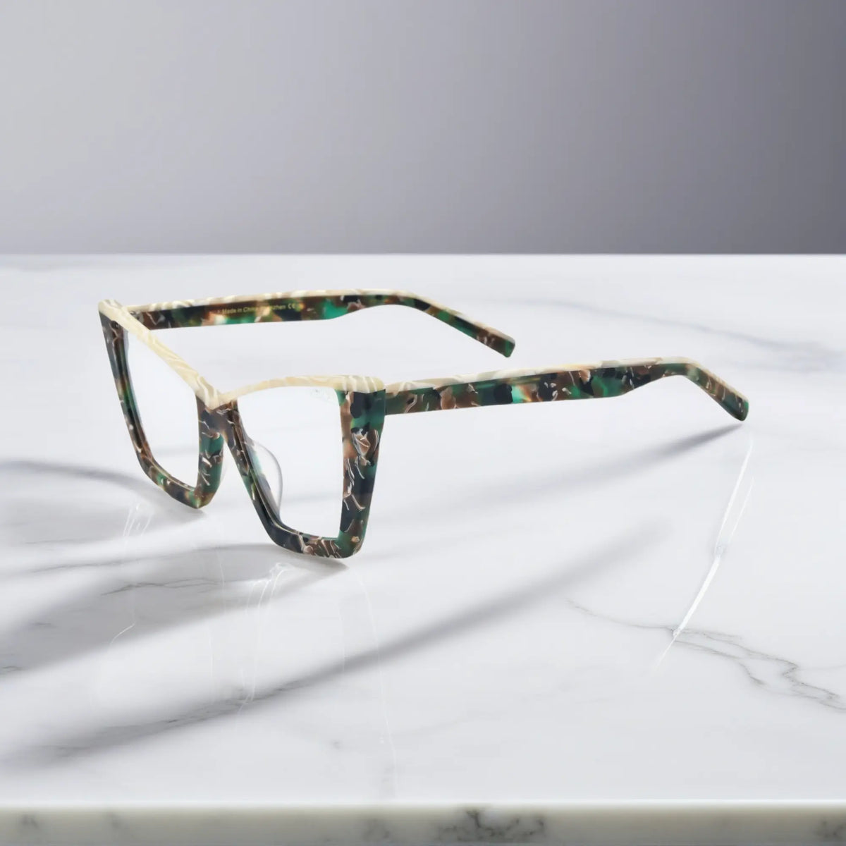 Side image of VoyueLens Olive Tortoise glasses showing full acetate temples and refined curves of the oversized butterfly frame