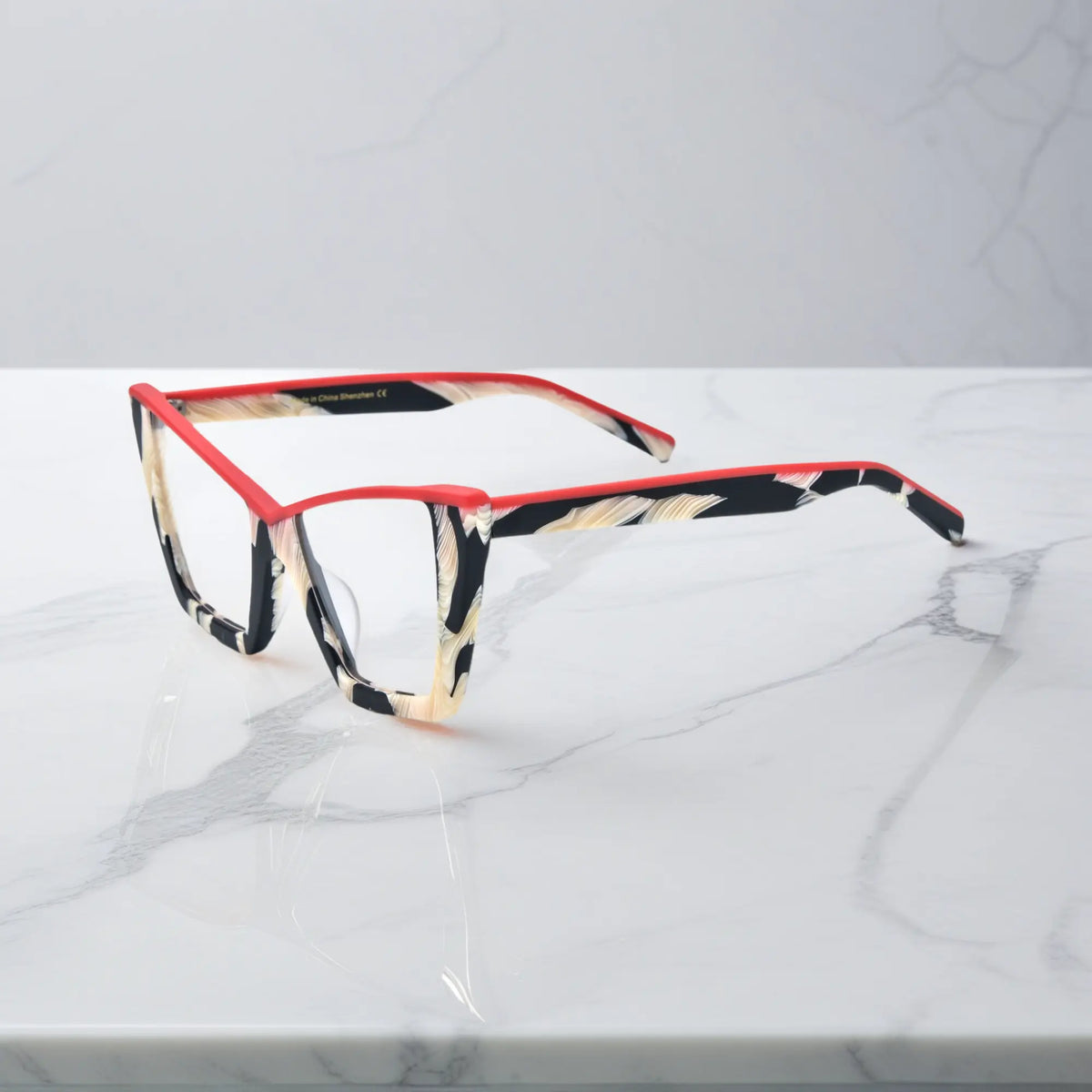 Side profile of VoyueLens Scarlet Ivory Feather glasses, with vivid red detail and sculptural full-rim acetate temples
