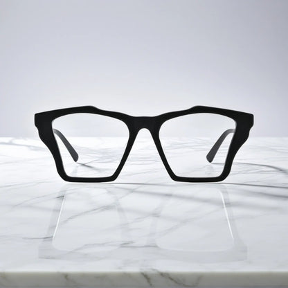 Front-facing view of VoyueLens Charcoal Black butterfly eyeglass frame featuring solid matte black with subtle gray temples, showcasing its signature matte butterfly design.