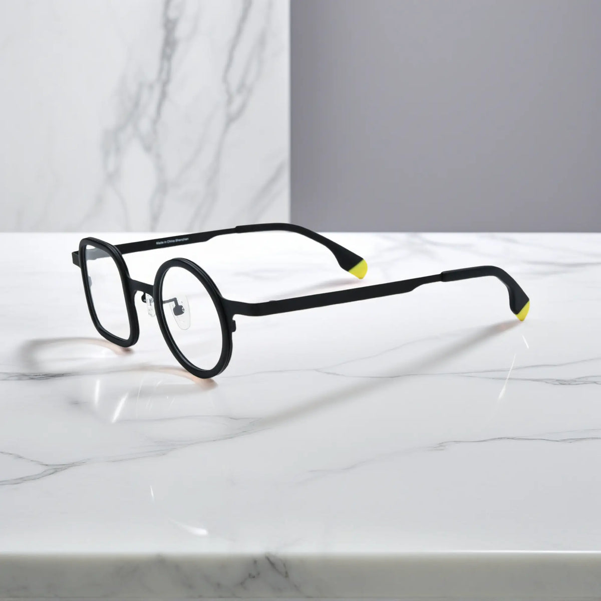 Sleek side profile of Charcoal Black VoyueLens frame with ultra-light titanium build.