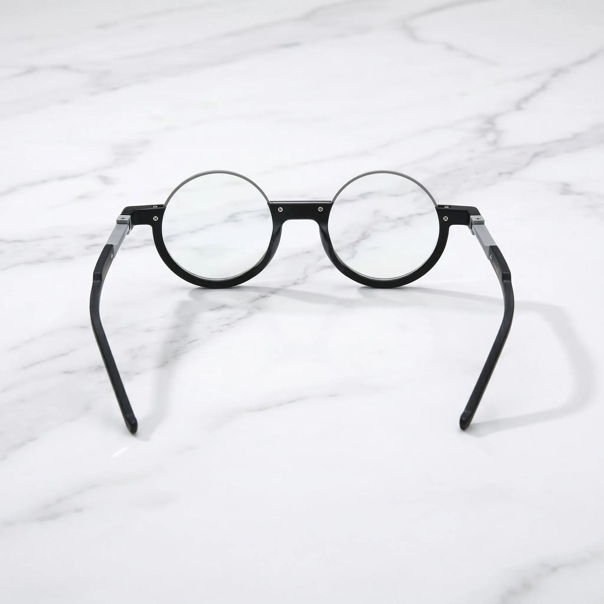 Rear view of Charcoal Silver eyeglasses showcasing high-polish silver core and matte black contrast.