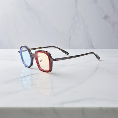 VoyueLens geometric eyeglasses in Chestnut Blue color, side view showing dual-tone design and spring hinges.