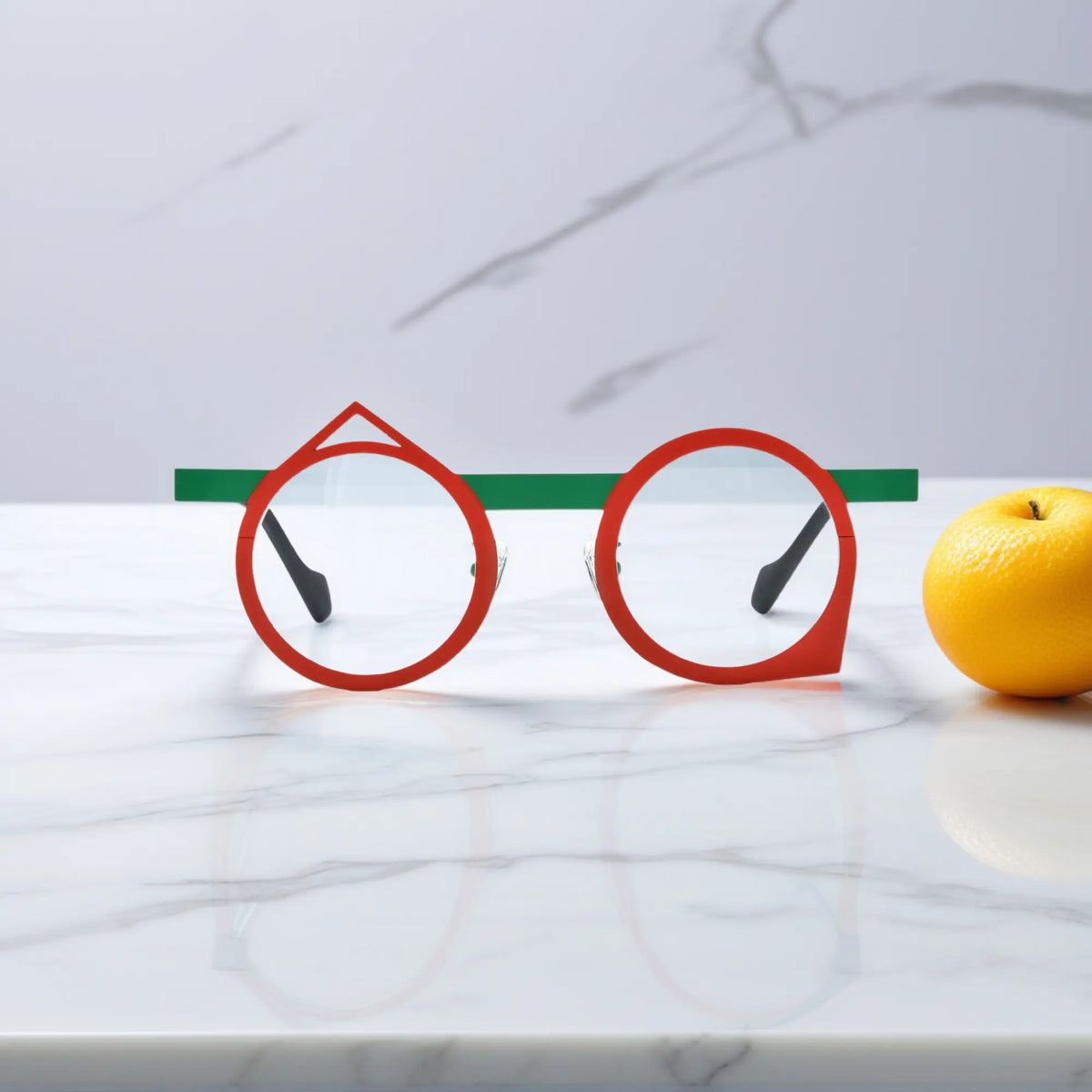 Front view of VoyueLens VL185801 geometric eyeglasses with a red-green Chili Emerald titanium frame, featuring a bold retro polygonal shape.