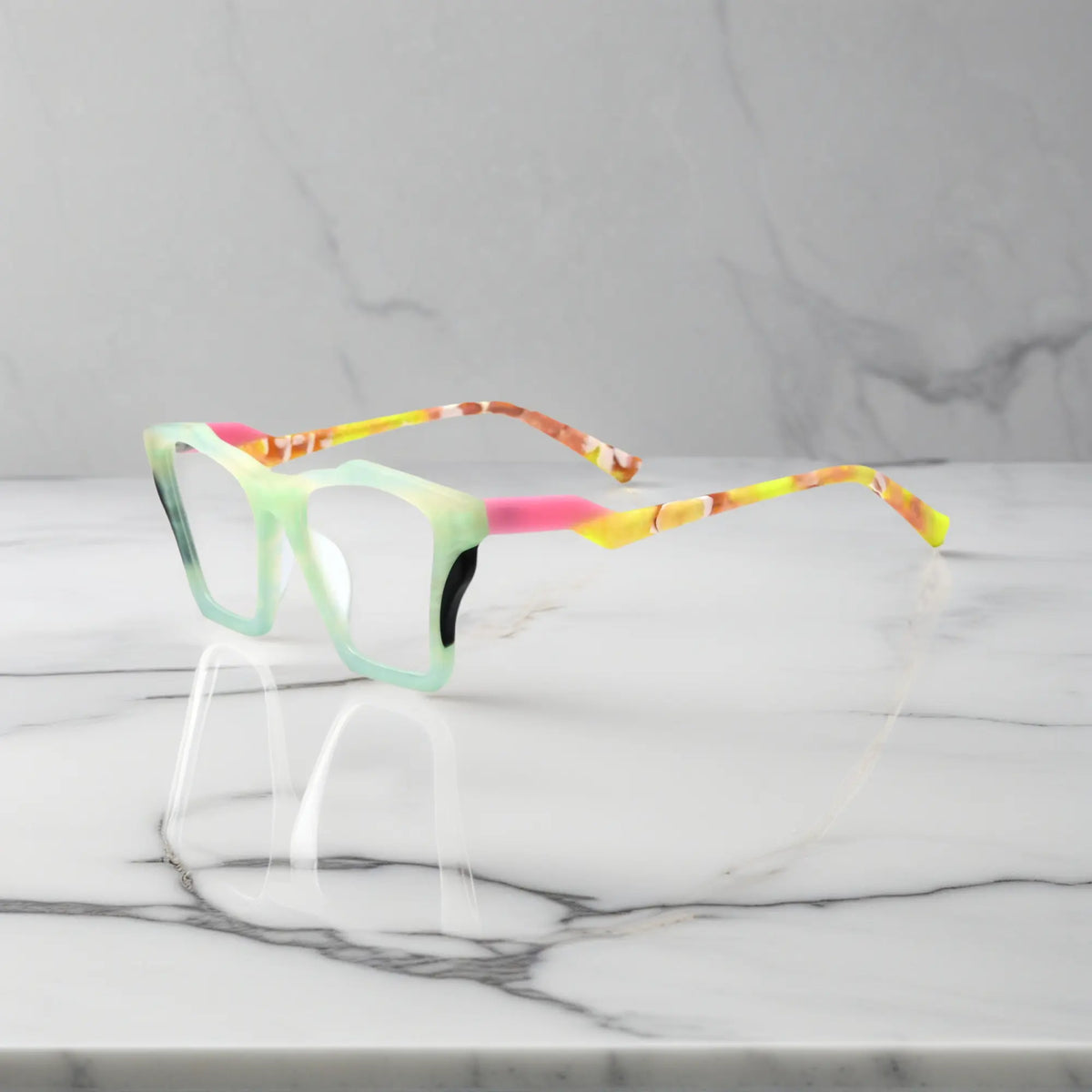 Side profile of VoyueLens Citrus Fade glasses, highlighting lime green front with pink-accented temples and ergonomic acetate arms.