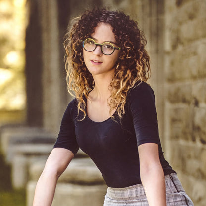Model styling the VoyueLens Citrus Fade glasses with bright accents perfect for bold, sunny fashion.