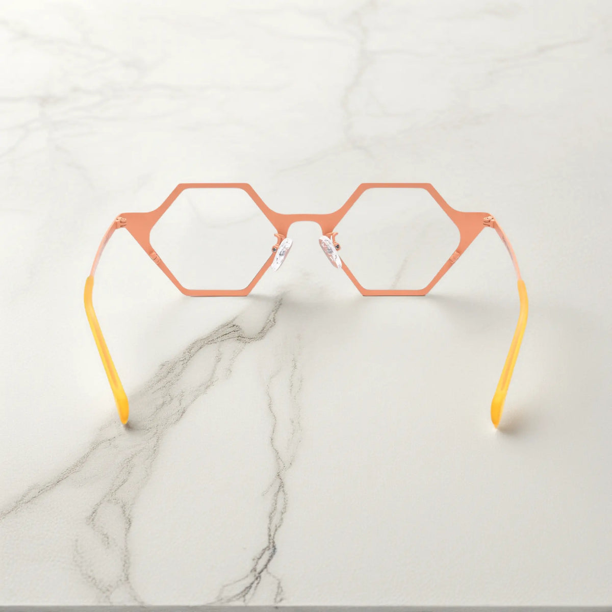 Back angle of VoyueLens VL185881 in Coral Frost – polygonal pastel metal frame