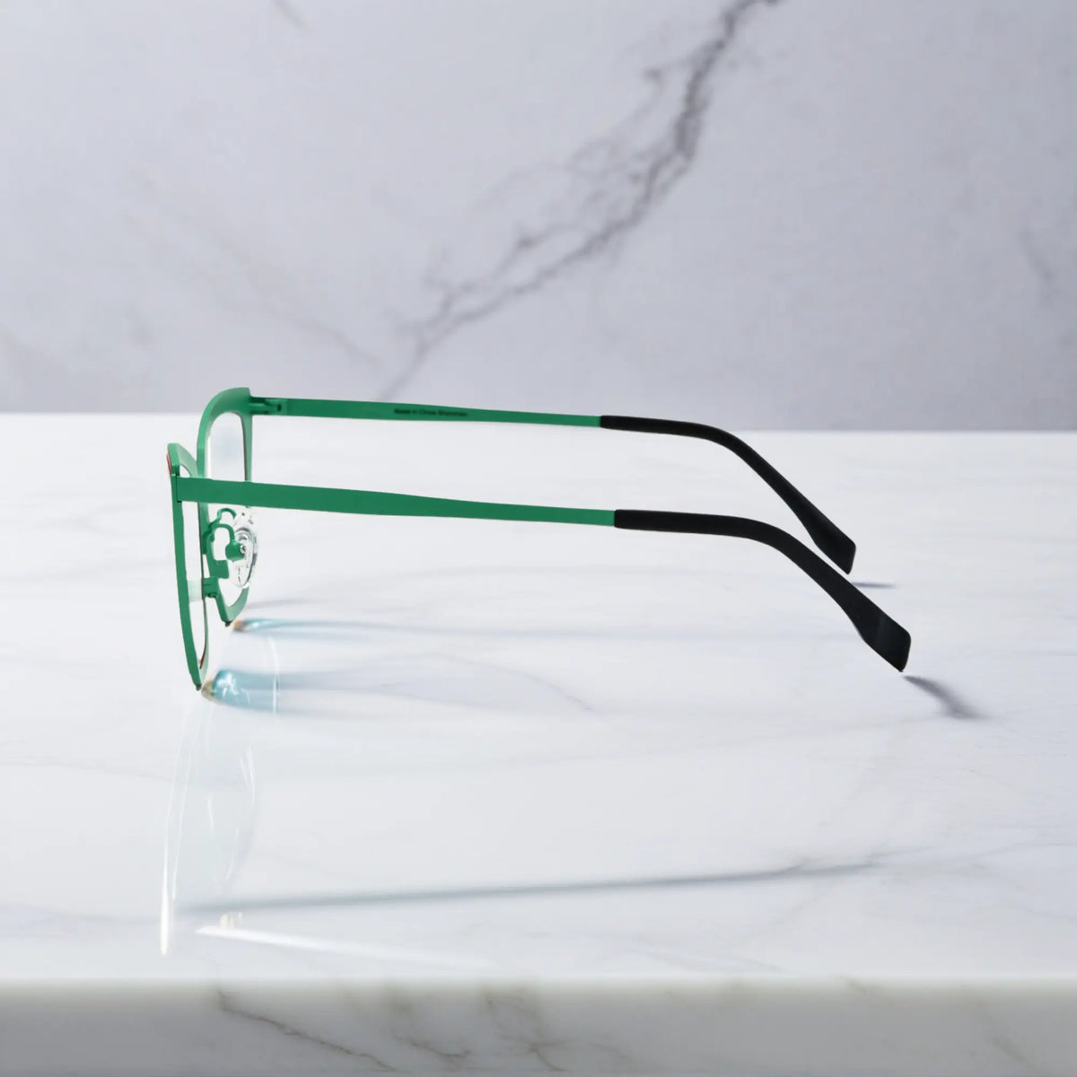 Side profile of red-green VoyueLens VL185809 cat-eye titanium glasses