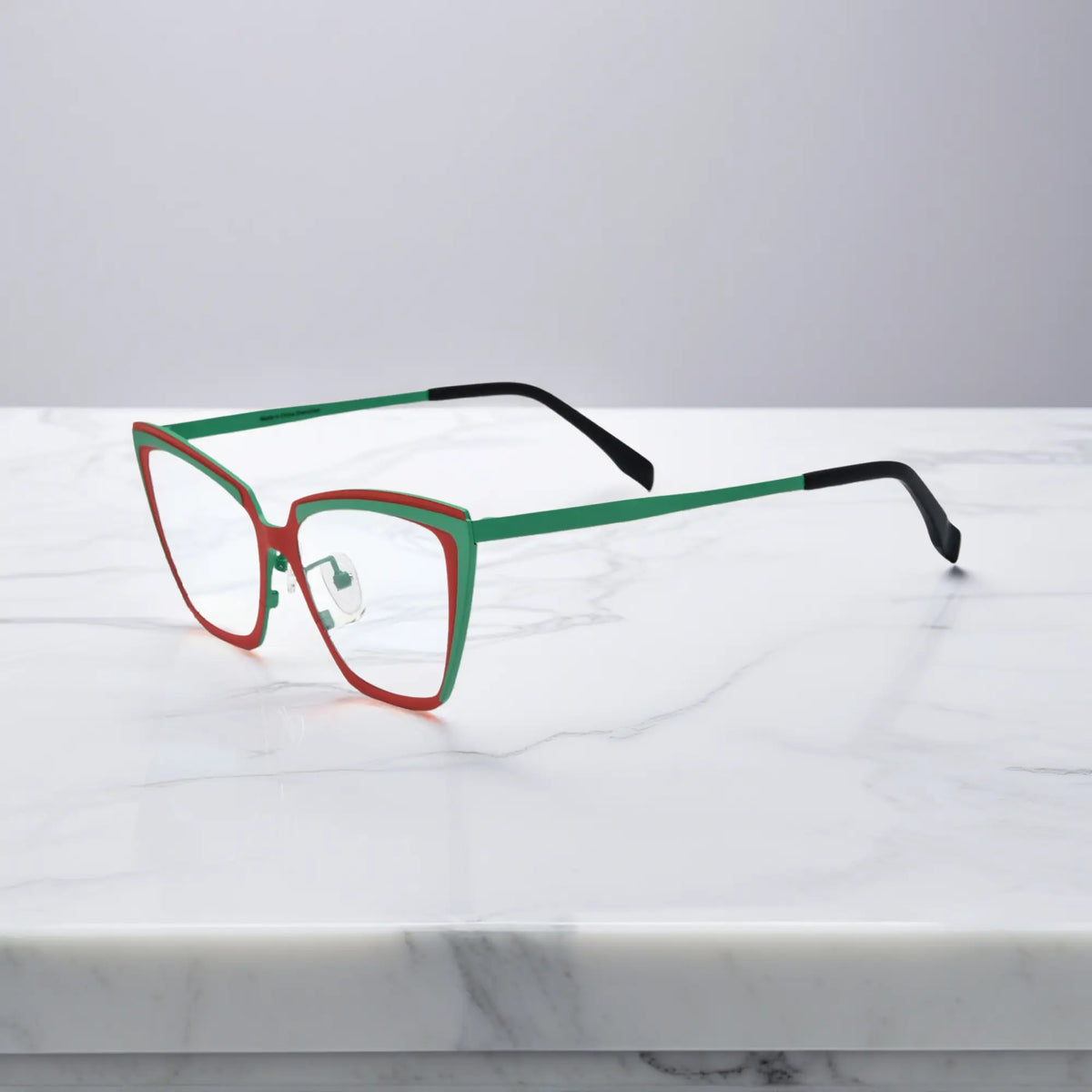 Side view of red-green VoyueLens VL185809 cat-eye titanium glasses