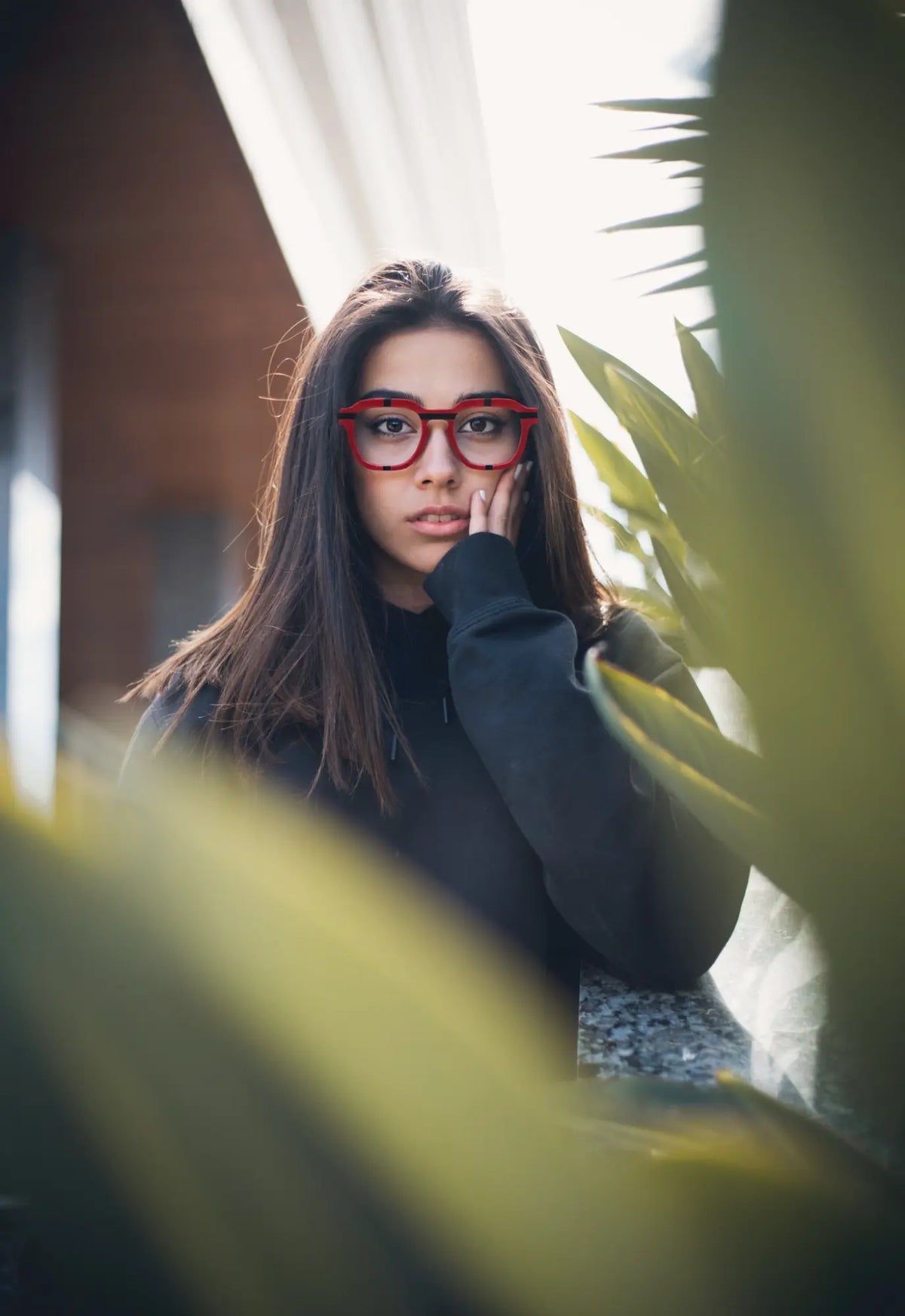 Urban portrait of model in VoyueLens Crimson Impact eyeglasses