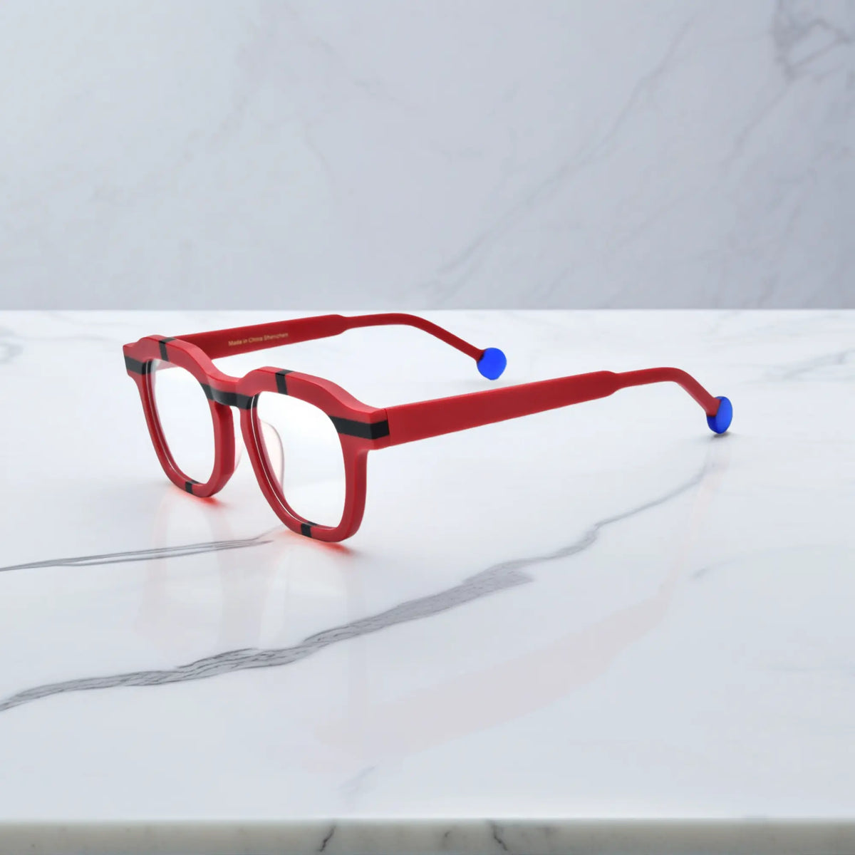 Side view of VoyueLens VL19363 Crimson Impact red eyeglasses with blue tips