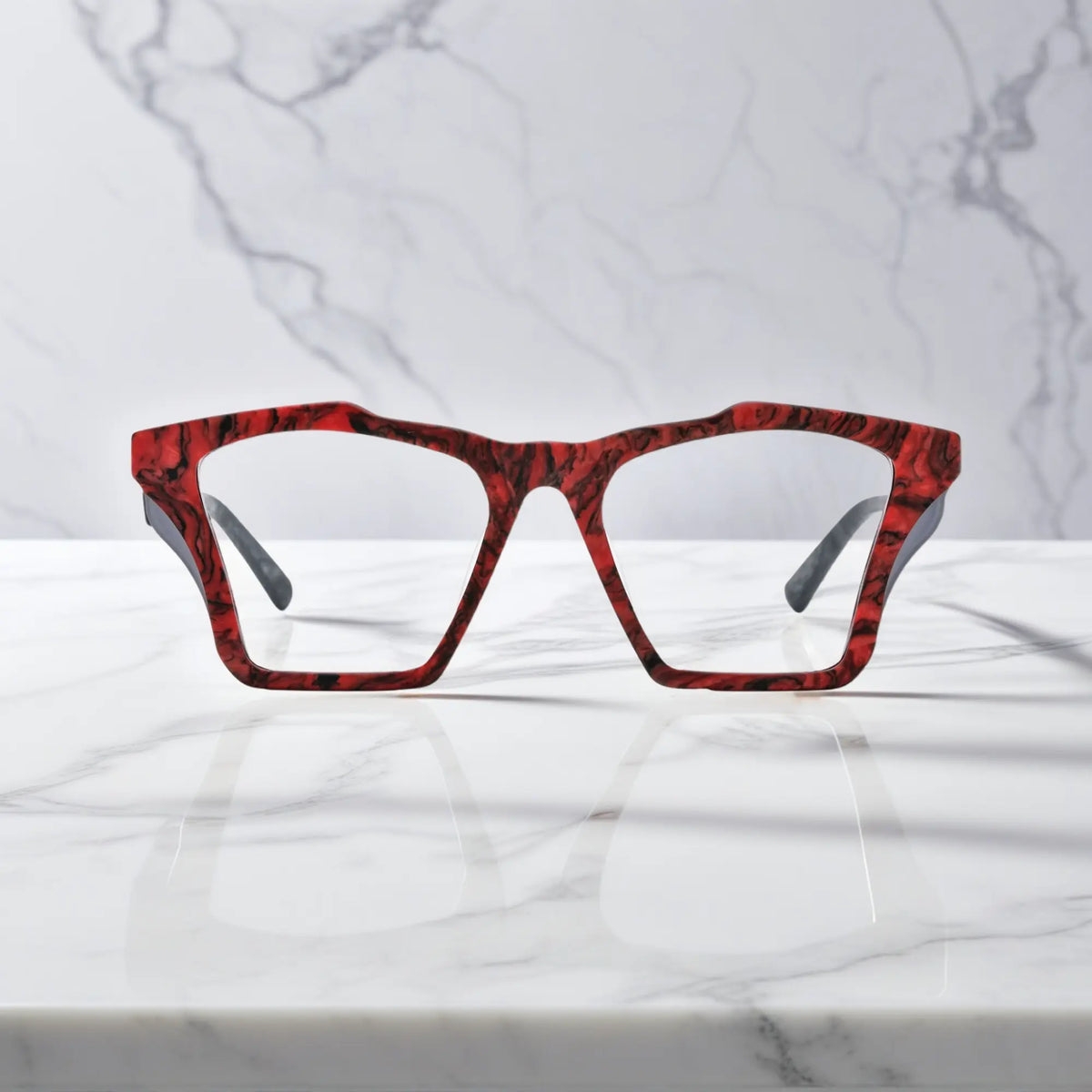 Front-facing view of VoyueLens Crimson Nebula butterfly eyeglass frame featuring matte crimson red with cosmic black accents, showcasing its signature matte butterfly design.