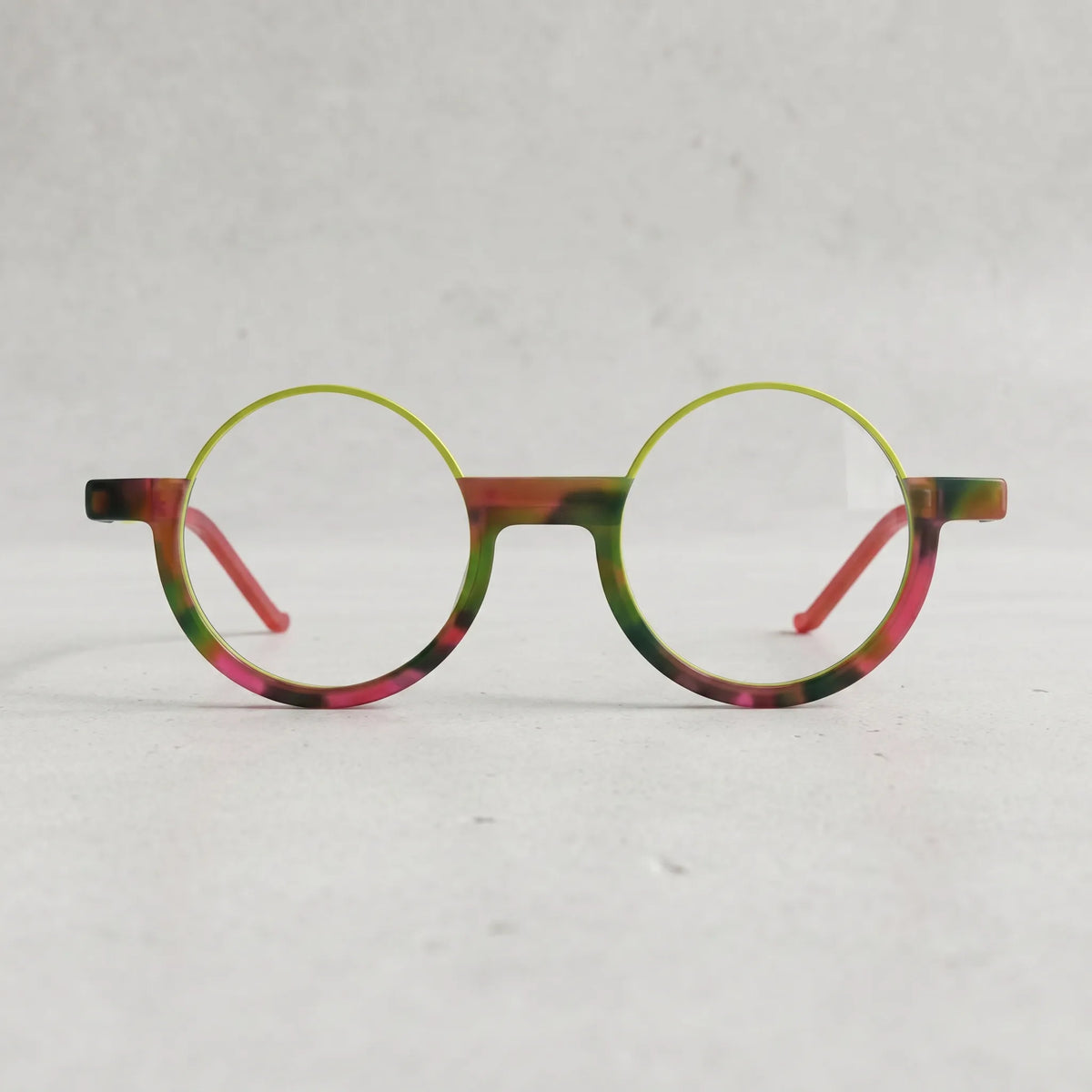 Front-facing Crimson Nebula eyeglasses in red-green blend, designed by VoyueLens for a cosmic statement look.