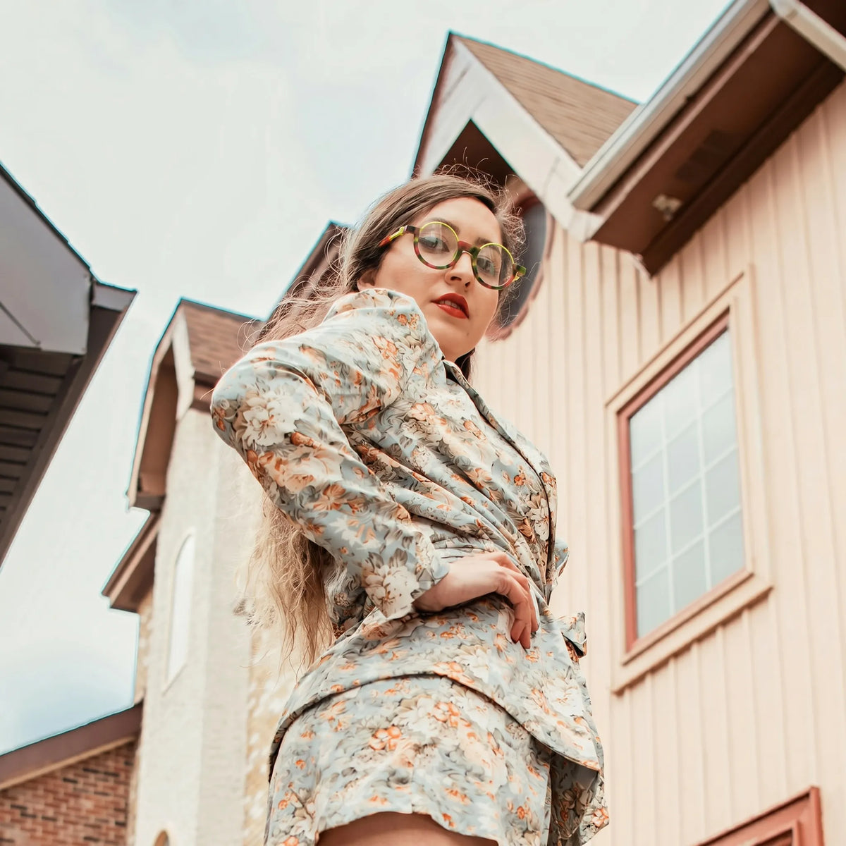 Model shot featuring Crimson Nebula VoyueLens eyeglasses—bold, cosmic, and full of personality.
