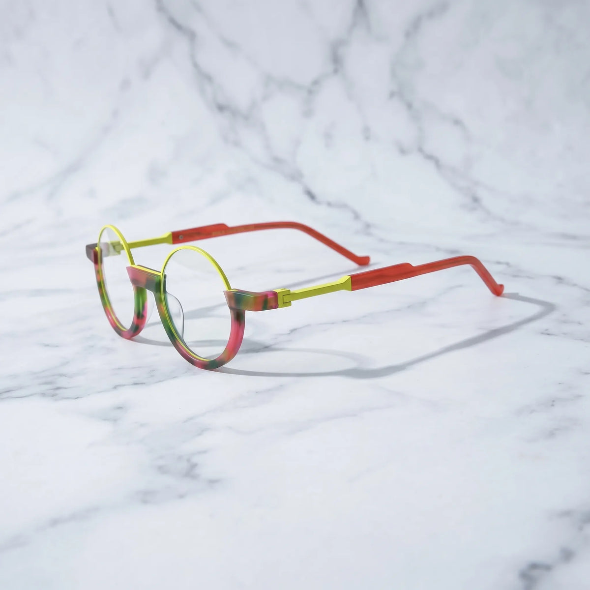 Side profile of Crimson Nebula frame showing glowing red hues transitioning into forest green.