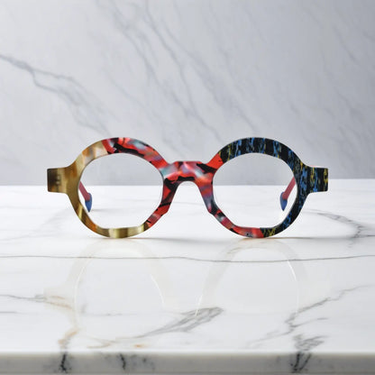 Front-facing image of Crimson Nebula polygon eyeglasses by VoyueLens, swirling red matte finish with bold artistic lines