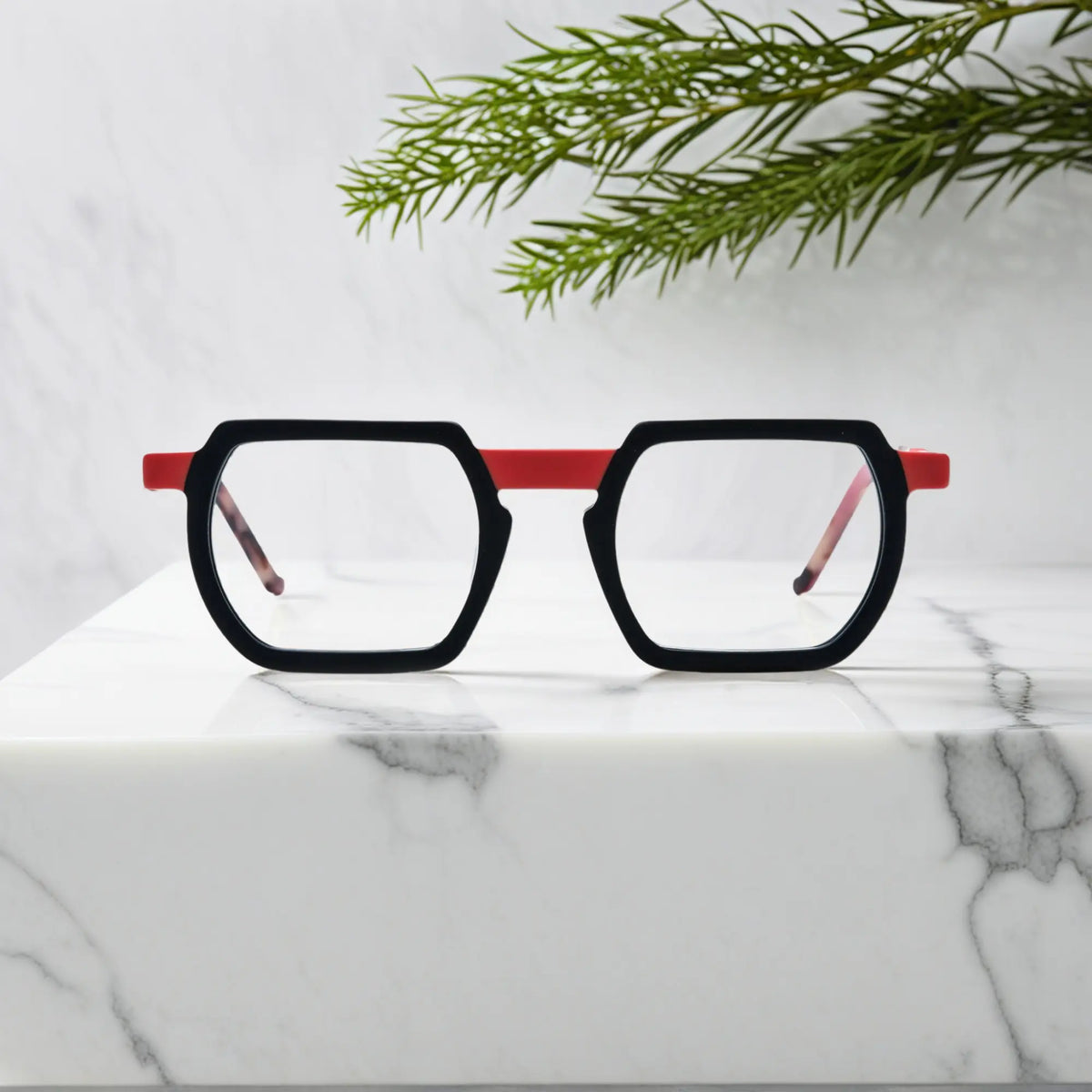 Front angle of VoyueLens Crimson Noir square frames in matte black with deep crimson accents
