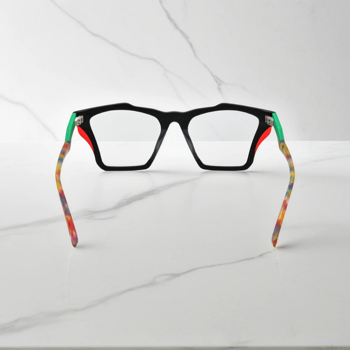 Rear view of VoyueLens Crystal Confetti frame, displaying translucent frosted acetate with pastel speckles from the inner frame and hinge area.