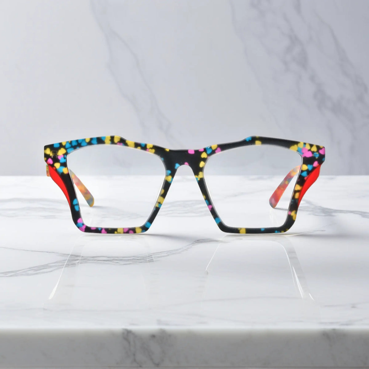 Front-facing view of VoyueLens Crystal Confetti butterfly eyeglass frame featuring translucent frosted acetate with pastel speckles, showcasing its signature matte butterfly design.