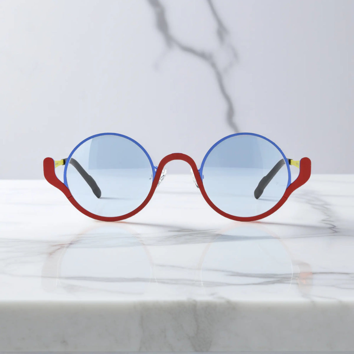 Front view of VoyueLens ChromoPop eyeglasses in Electric Rust – blue and red titanium mix
