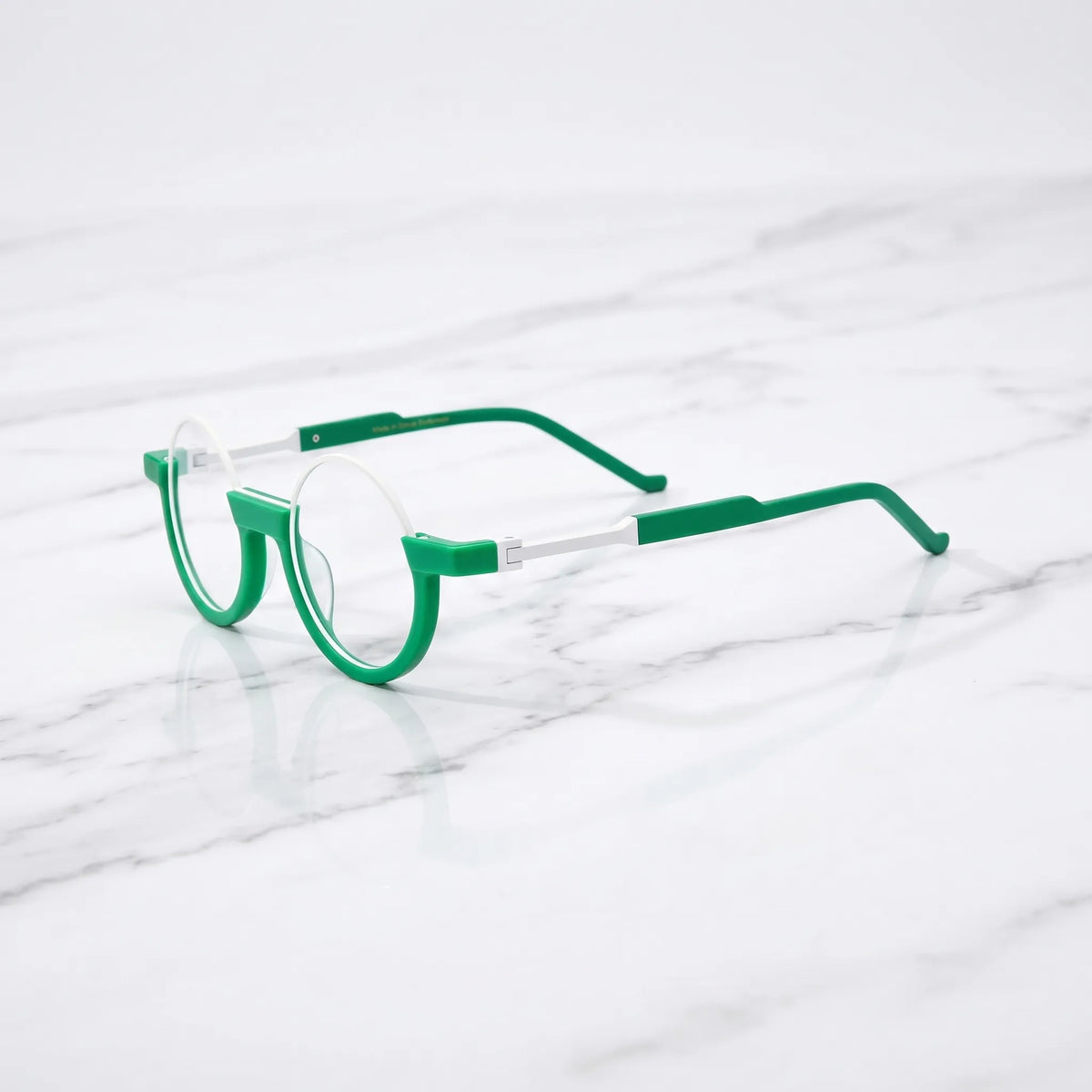 Side view of Emerald Ice frame with cool mint temples and balanced translucent palette.
