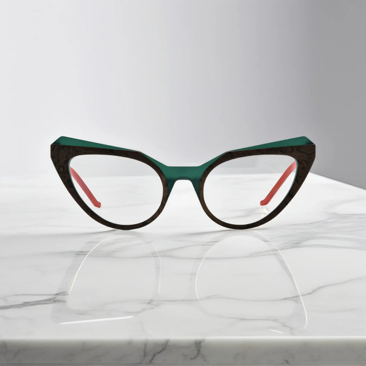 Front view of VoyueLens butterfly eyeglasses in Forest Marble color, featuring a sculpted matte acetate frame with earthy green swirls.