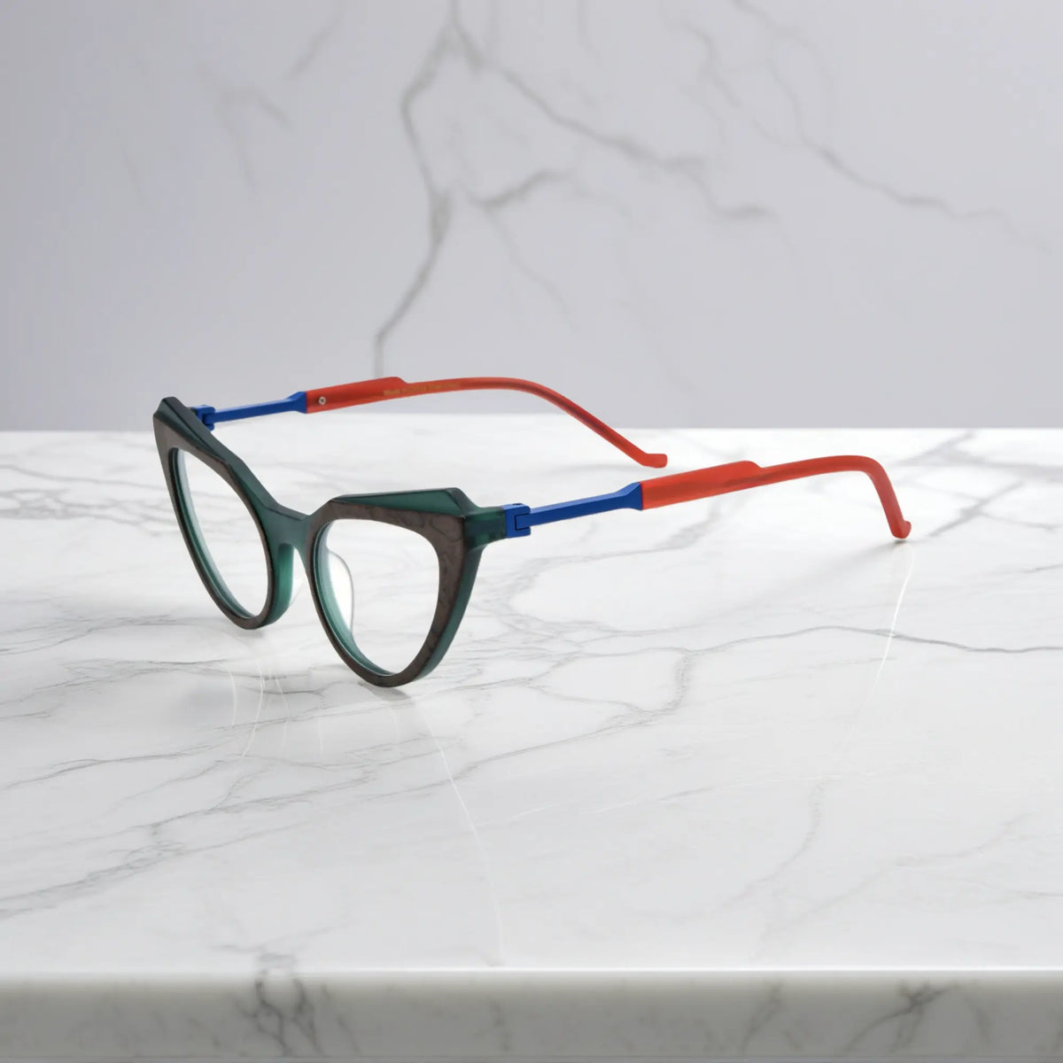 Side profile of Forest Marble VoyueLens butterfly eyeglasses with translucent green acetate arms and spring hinges.