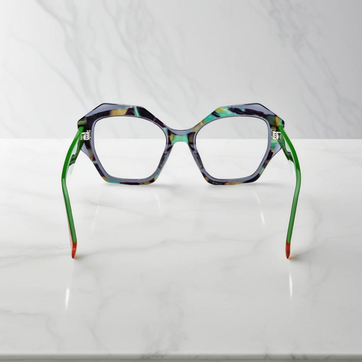 Rear view highlighting color-blocked orange tips and lightweight spring hinge construction.