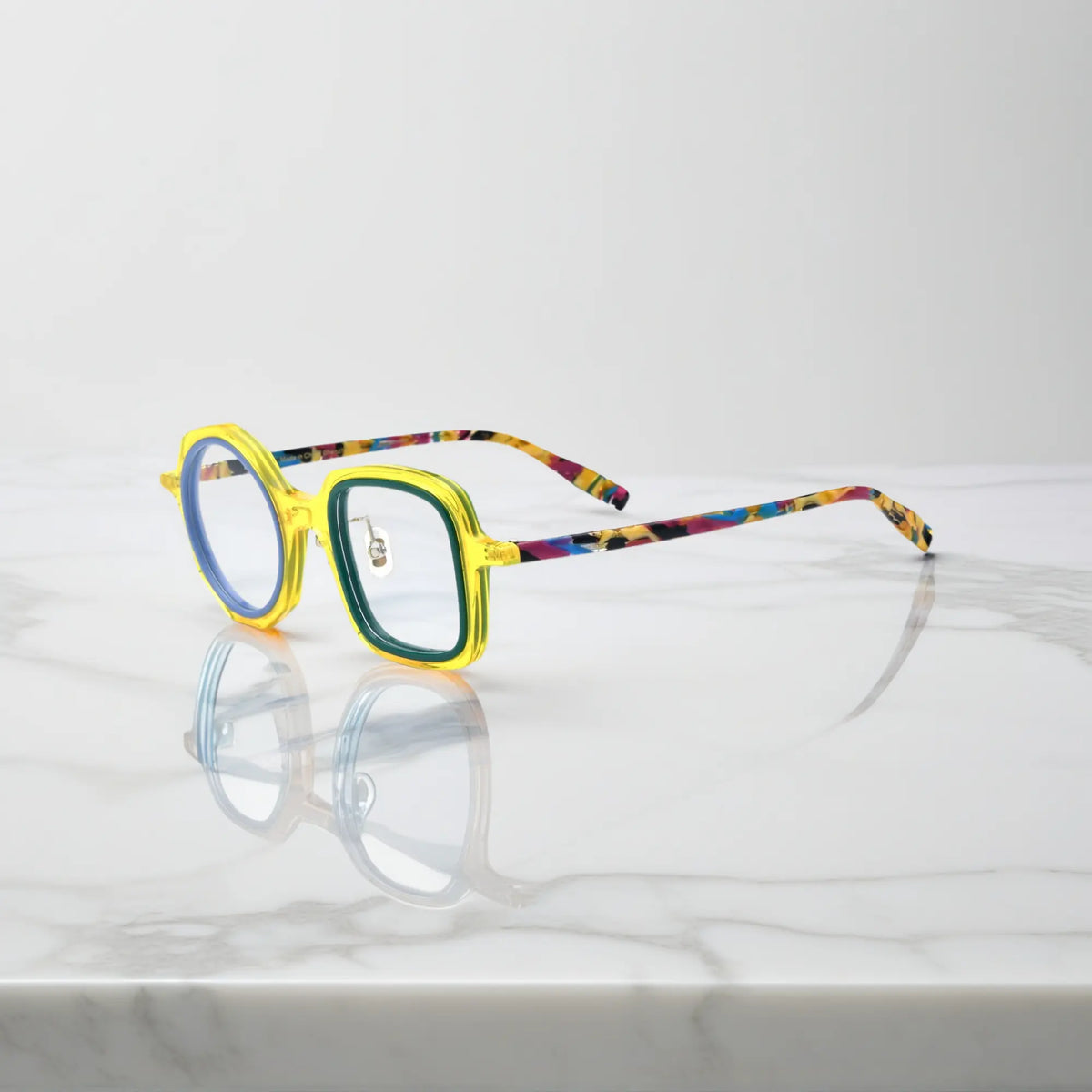 VoyueLens geometric eyeglasses in Honey Mint color, side view showing dual-tone design and spring hinges.