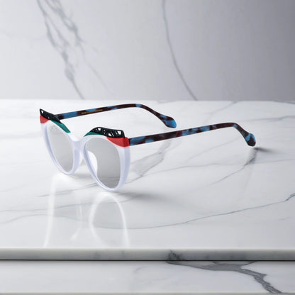 Side View of VoyueLens Ice Coral cat-eye eyeglasses with frosty white-to-coral fade and signature lace-pattern design.