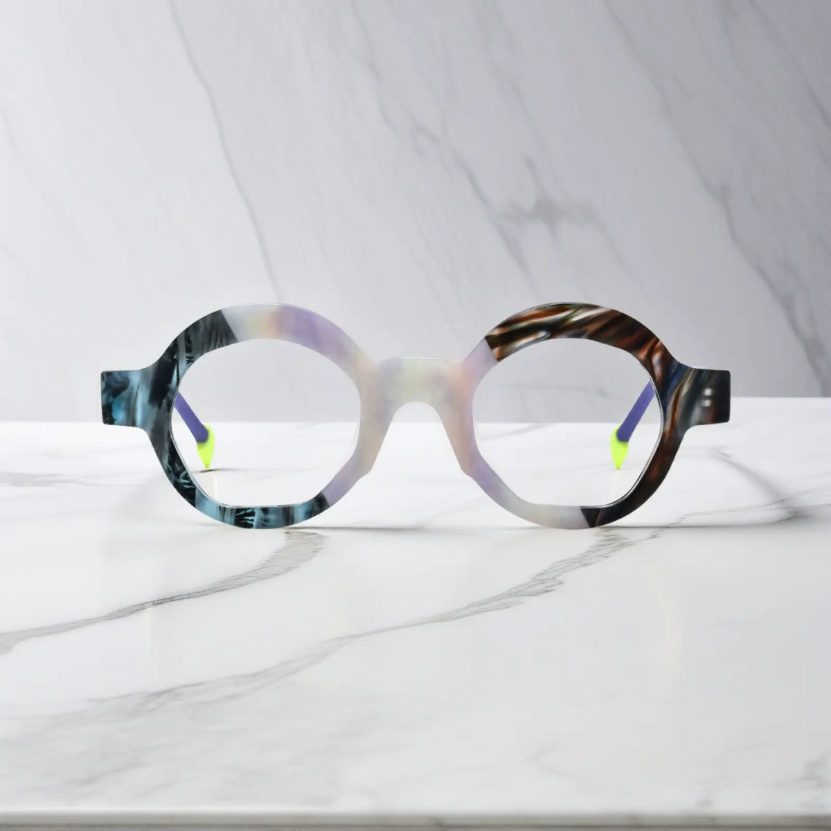 Front display of VoyueLens VL19355 Ice Marble polygon eyeglasses featuring a marbled matte finish and frosty purple temple arms
