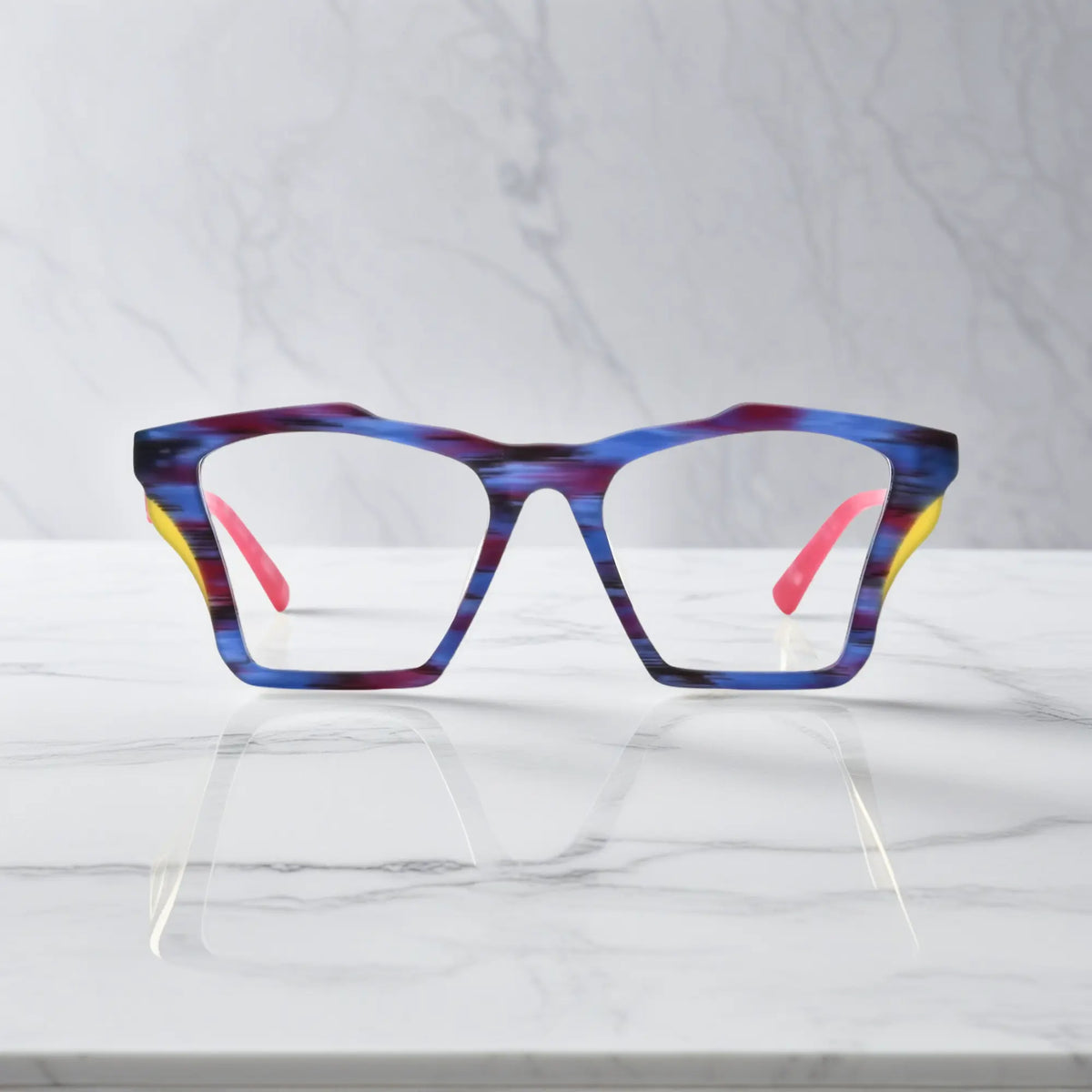 Front-facing view of VoyueLens Indigo Wave butterfly eyeglass frame featuring matte striped indigo with flowing tonal patterns, showcasing its signature matte butterfly design.