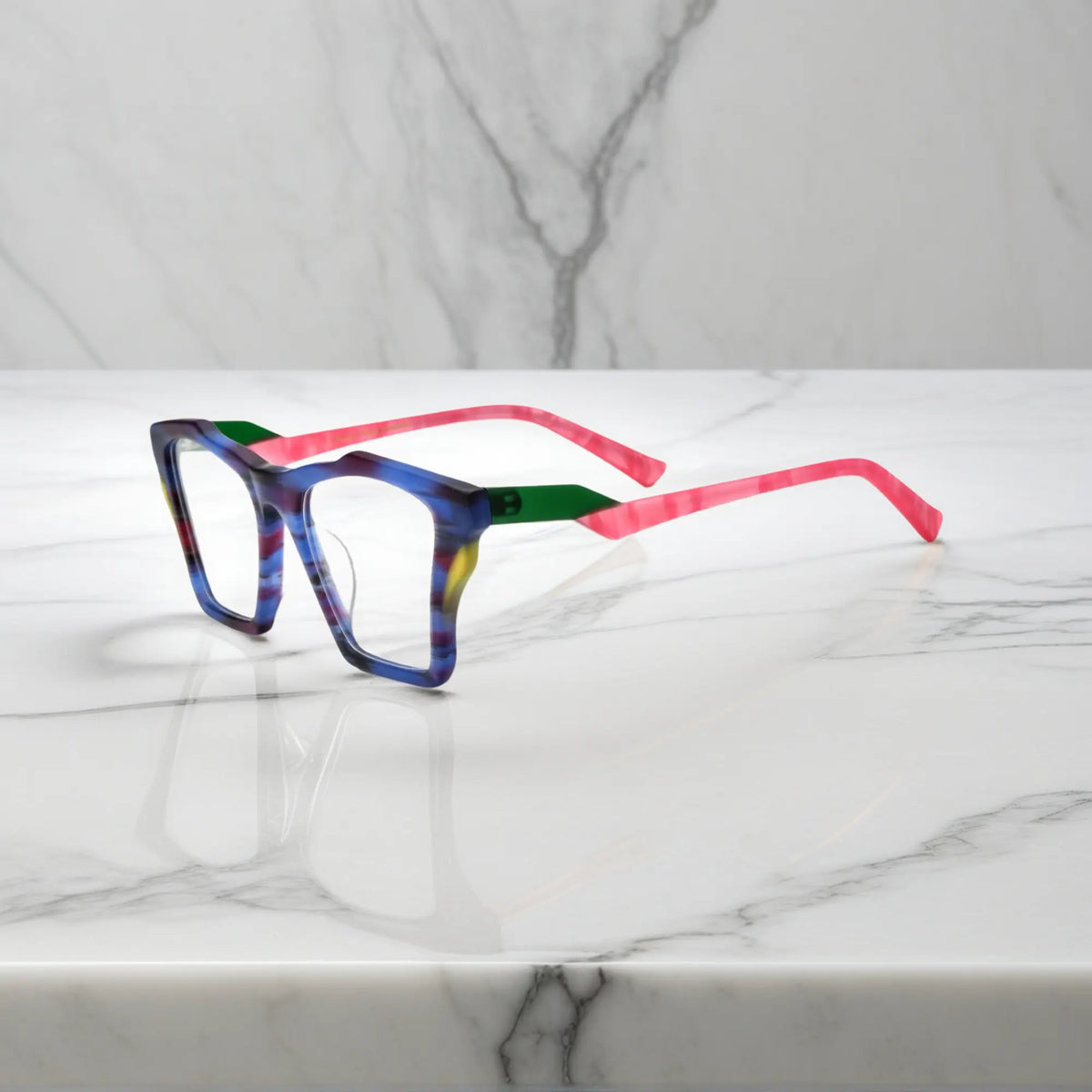 Side profile of VoyueLens Indigo Wave glasses, highlighting matte striped indigo with flowing tonal patterns and ergonomic acetate arms.