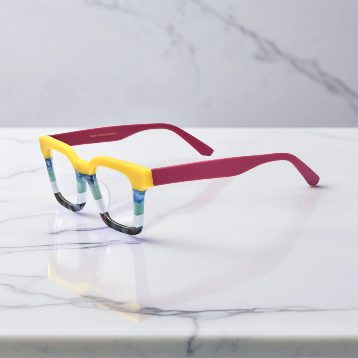 Side view of Lemon Sorbet eyeglasses in soft yellow and white block design