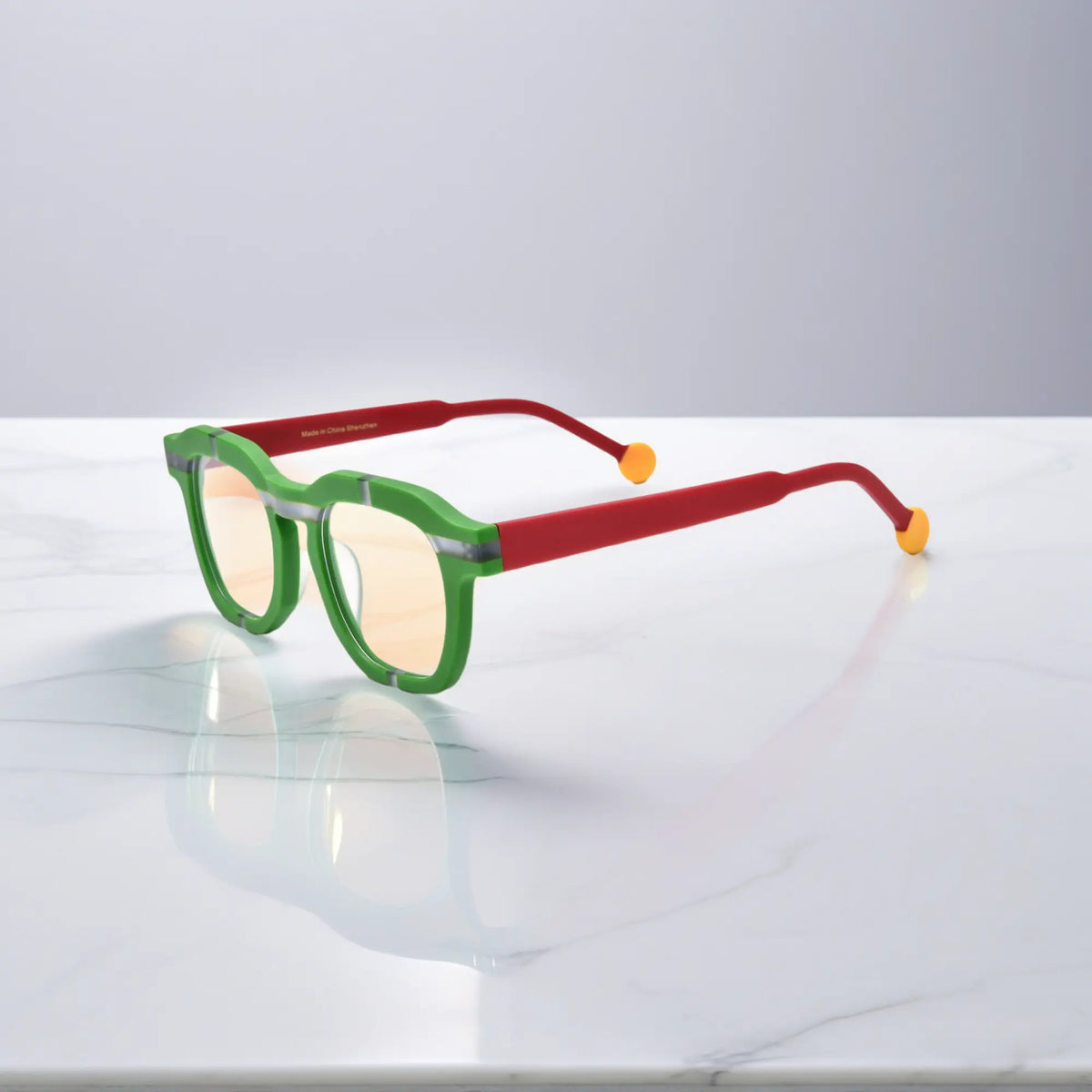 Side view of VoyueLens VL19363 Lime Blaze matte green eyeglasses with red temples and yellow tips