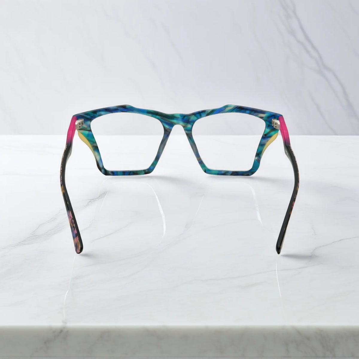Rear view of VoyueLens Ocean Tortoiseshell frame, displaying matte teal and turquoise tortoiseshell finish from the inner frame and hinge area.