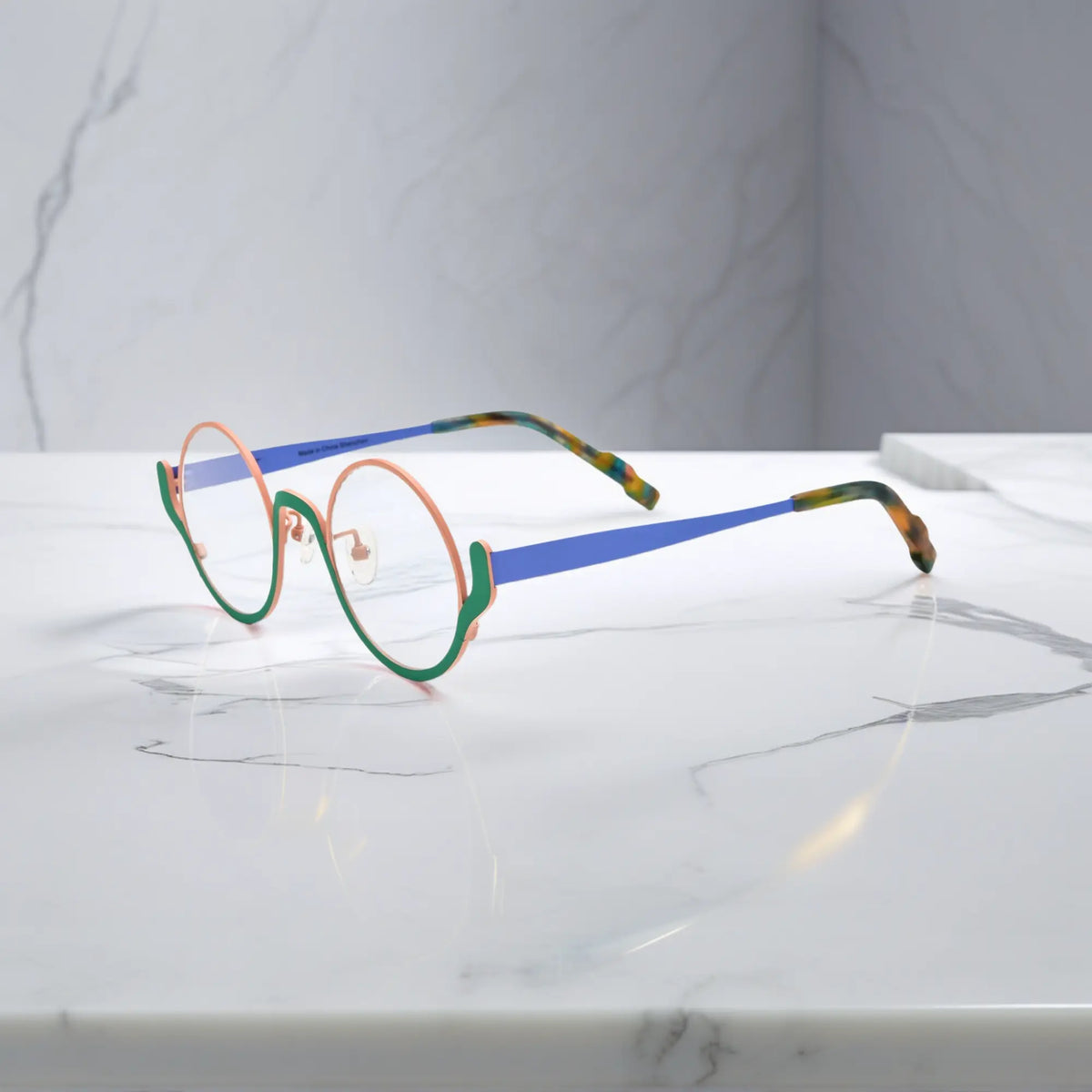 Side view showing blue titanium temple and tortoiseshell tips – Pastel Forest variant